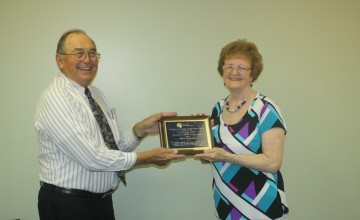 Rich Kern thanks Eileen Rodammer for all the work she's done for the Michigan District