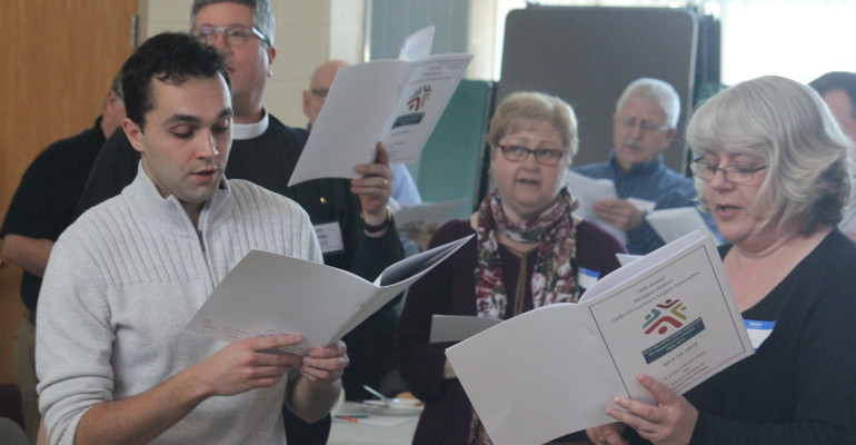 Convention attendees participate in hymn sing.